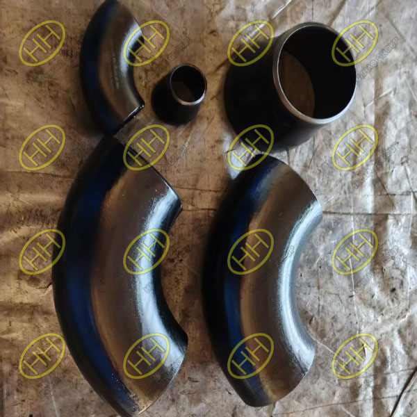 ASTM A860 WPHY65 seamless 90 degree long radius elbows and MSS SP-75 WPHY65 eccentric reducers ready for shipment